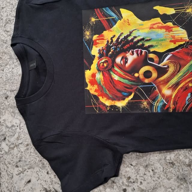A full-color illustrated portrait heat-pressed onto a black t-shirt